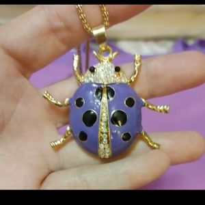 New purple ladybug goldtone necklace